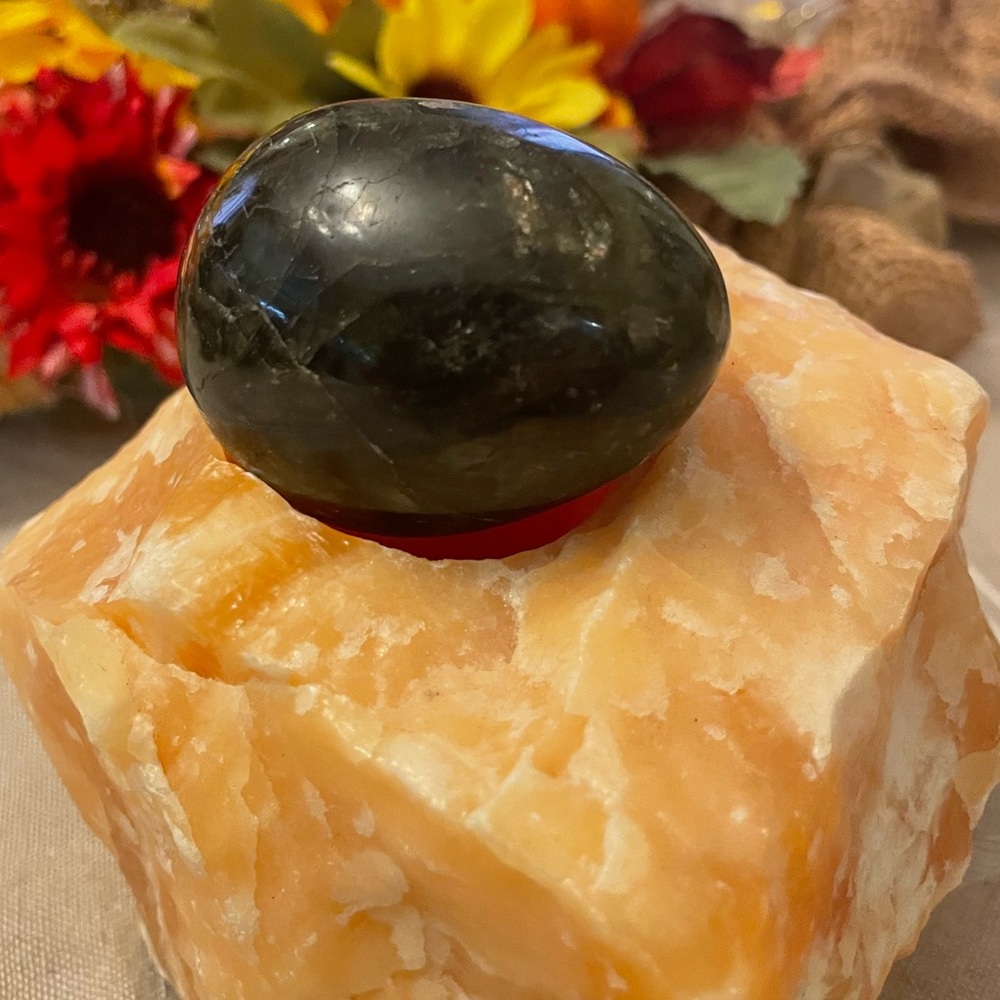 Green Labradorite in an egg shape with many inclusions.  L 8” x W  7”